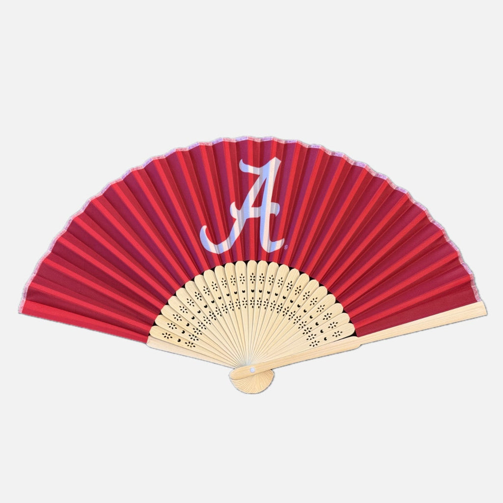 A crimson folding hand fan with a white Alabama Crimson Tide 'A' logo on the upper section, featuring bamboo ribs.